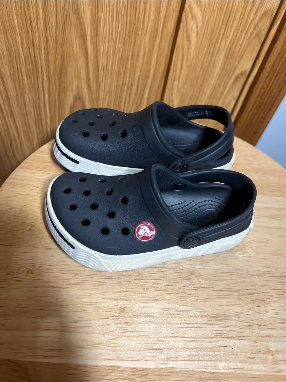 CROCS Kids Black Clogs with White Trim and Red Logo